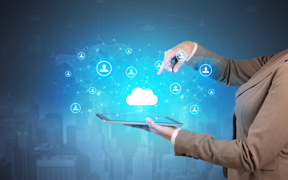 Hand holding tablet and showing staffs with global connectivity concept Hand holding tablet and showing staffs with global connectivity concept